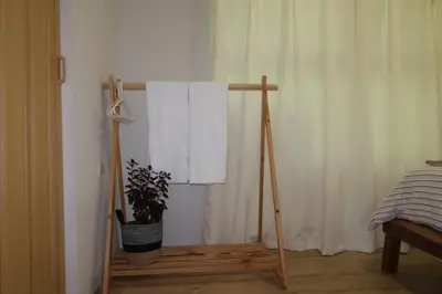 a wooden tripod with a plant in a room at Cabin Retreat - Nature & Privacy - La Fortuna in Fortuna