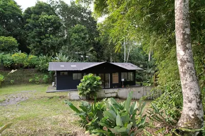 a small house in the middle of a yard at Cabin Retreat - Nature & Privacy - La Fortuna in Fortuna