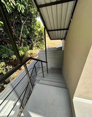 a set of stairs leading up to a building at Josuary in Brasilito