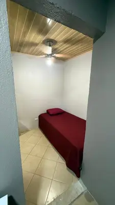 a small room with a red bed in the corner at Casa Antioquia #6 in Garita