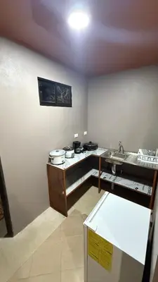 a kitchen with a sink and a counter with pots and pans at Casa Antioquia #6 in Garita