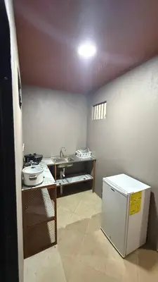 a small kitchen with a refrigerator and a sink at Casa Antioquia #6 in Garita