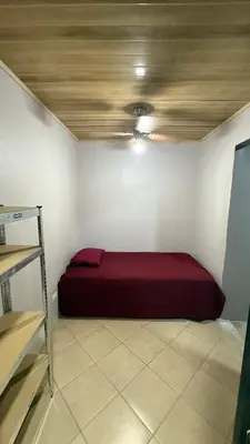 a bedroom with a red bed in a room at Casa Antioquia #6 in Garita