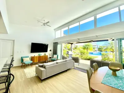 a living room with a couch and a table at 3BR Villa with Pool - 10 Min Walk to Beach & Surf in Playa Avellana