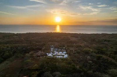 an aerial view of a marina at sunset at 3BR Villa with Pool - 10 Min Walk to Beach & Surf in Playa Avellana