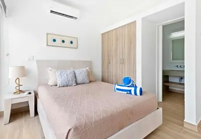 a bedroom with a bed with a blue object on it at 3BR Villa with Pool - 10 Min Walk to Beach & Surf in Playa Avellana