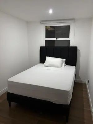 a large bed in a room with a window at Family home in Cieneguita