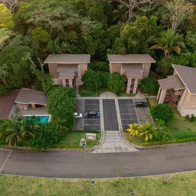 an aerial view of a house with a parking lot at Mistico Beach Residence in Muñeco