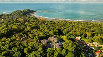 an aerial view of a house and the ocean at Ocean-Mountain views 2 Bdr, Villa Pelicano in Dominicalito