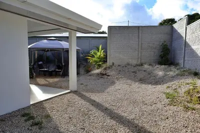 a house with a patio with a tent and a fence at Casa Aldama with private pool Near Playa Tamarindo in Santa Cruz