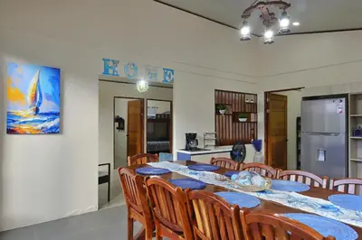 a kitchen and dining room with a table and chairs at Casa Aldama with private pool Near Playa Tamarindo in Santa Cruz