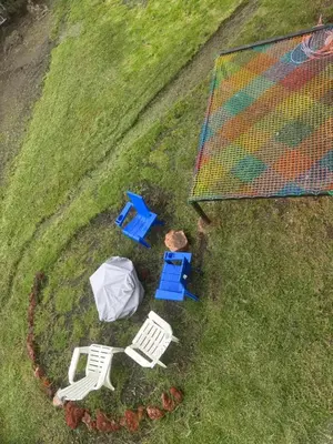 an overhead view of two chairs and a table and umbrella at Chukita Loft en Villa Ron Dafa in Fraijanes