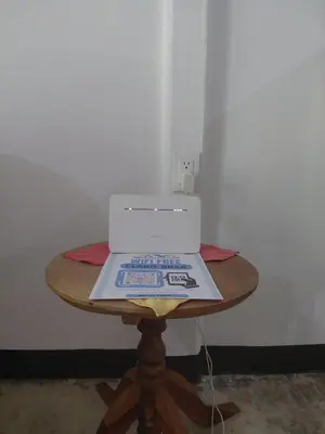 a table with a laptop sitting on top of it at Inmoexito Eco Tours in Upala