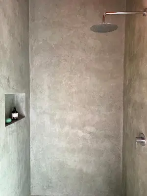 a bathroom with a shower with a sink and a light at Casa Canopy in Manzanillo