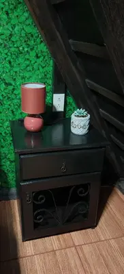 a black dresser with a candle on top of it at Casa Tucán in Ángeles