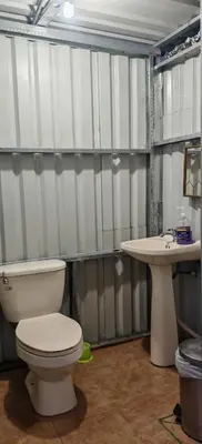 a bathroom with a toilet and a sink at Casa Tucán in Ángeles