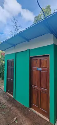 a small building with two doors and a blue roof at Casa Mono in Ángeles