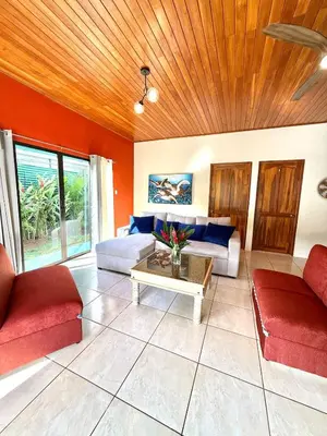a living room with two couches and a table at Casa Jardín Arenal in San Francisco