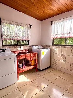 a kitchen with two washer and dryer in it at Casa Jardín Arenal in San Francisco