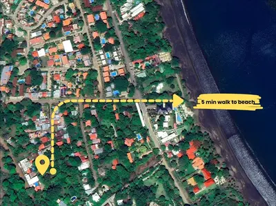a map of a city with a yellow arrow at Walk to Beach - Hot Tub - Pool - Comfort & Space in Coco