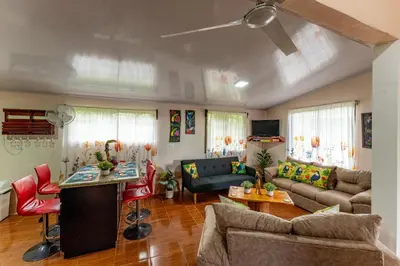 a living room with a couch and a table at Toucan River Retreat - River Access, AC & Jacuzzi in San Francisco