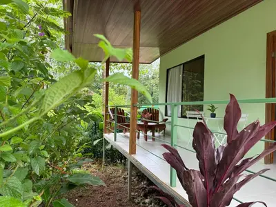 a house in the jungle with a porch at Quiet, Affordable Casita Close to Surf & Nature - 15 minutes drive to Samara beach in Nandayure