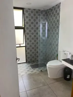 a bathroom with a shower and a toilet in it at Casa Pura Jungla in Santa Cruz
