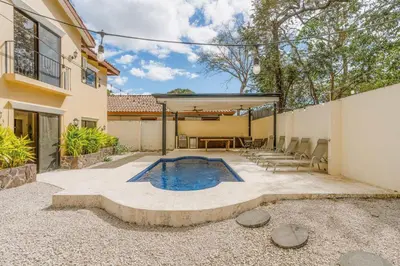 a swimming pool in the middle of a patio at Elegant Surfside Retreat with Private Pool Spacious Outdoor Patio & Walkable Beach Access in Potrero