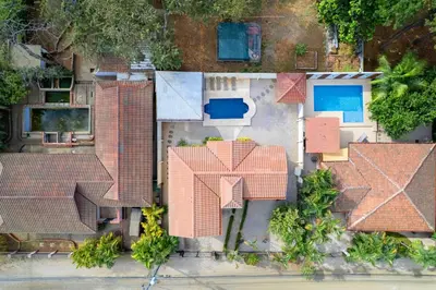 an overhead view of roofs of a house at Elegant Surfside Retreat with Private Pool Spacious Outdoor Patio & Walkable Beach Access in Potrero