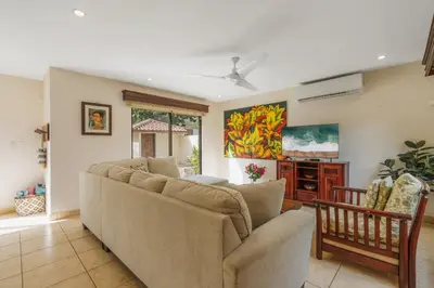 a living room with a couch and a tv at Elegant Surfside Retreat with Private Pool Spacious Outdoor Patio & Walkable Beach Access in Potrero