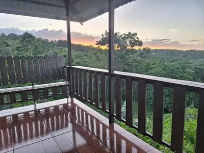 a balcony with a view of the forest at Cabaña tranquila con vistas a la montaña y naturaleza en Monterrey in Monterrey