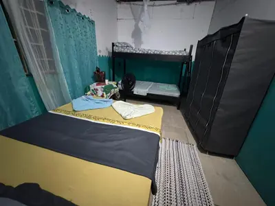 a bedroom with two bunk beds in a room at Ecobosque del Mar in Drake