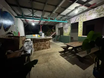 an empty room with a picnic table at Ecobosque del Mar in Drake