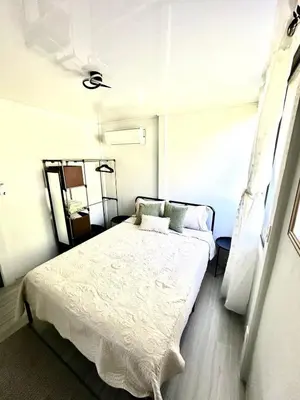 a bedroom with a large bed in a room at Piyiyo House 5 minutes from the beach walking in Uvita