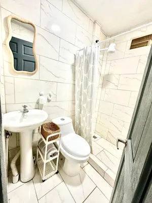 a bathroom with a toilet and a sink at Piyiyo House 5 minutes from the beach walking in Uvita