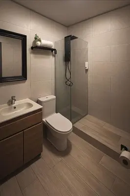 a bathroom with a shower and a toilet and a sink at Hotel Boutique 4 Estancias in San Ramón