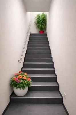a staircase with two potted plants in a building at Hotel Boutique 4 Estancias in San Ramón