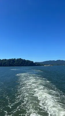 a boat in a large body of water at Casa Carao Peninsula de Nicoya - front beach