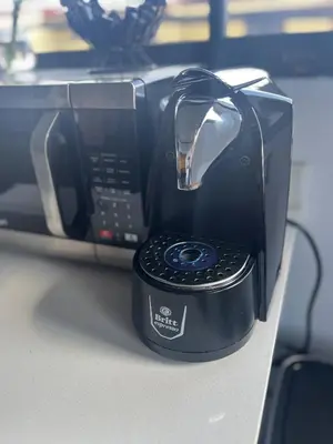a toaster sitting on top of a table at Cozy and Central Apartment in Alajuela, Perfect for Families in Alajuela City