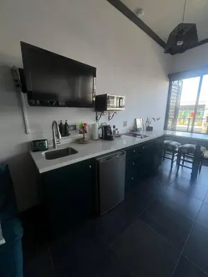 a kitchen with a sink and a counter top at Cozy and Central Apartment in Alajuela, Perfect for Families in Alajuela City