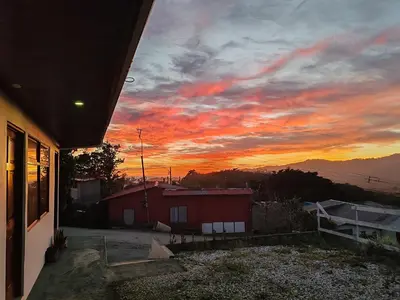 a sunset from the balcony of a house at Apartamentos Casa Don Luis in Monteverde Costa Rica