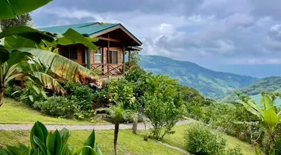 a house on top of a hill with a forest at El Verde Pacifico in San Luis
