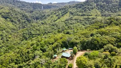 an aerial view of a house in the middle of a forest at El Verde Pacifico in San Luis
