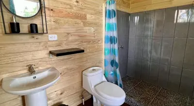 a bathroom with a sink and a toilet at El Verde Pacifico in San Luis