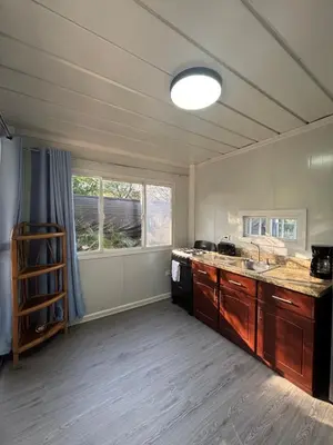 an empty kitchen with a sink and a stove at Casitas Maya in Nicoya