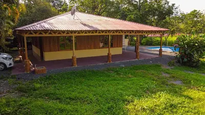 a pavilion in a yard with a pool at Casa Los Chorros in Agua Azul