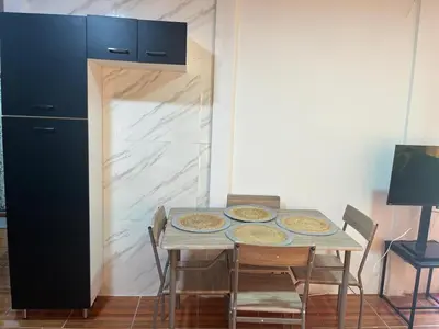 a kitchen with a table with three plates of food on it at Casa Brisa Azul 5 minutes from the beach in La Cruz