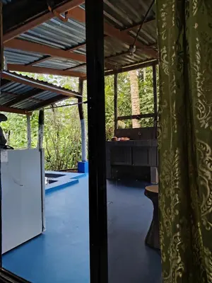 a view from the inside of a room with a table at Vértice Blue Mountain Lodge in San Lorenzo