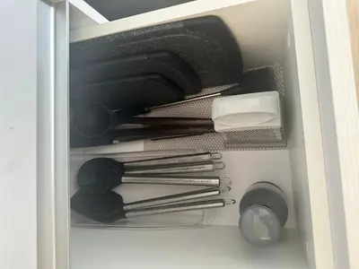a drawer with dishes and utensils in a cabinet at Secure & Confortable Apartment with green spaces in San Rafael