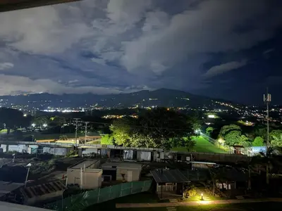 a view of a city at night at Secure & Confortable Apartment with green spaces in San Rafael